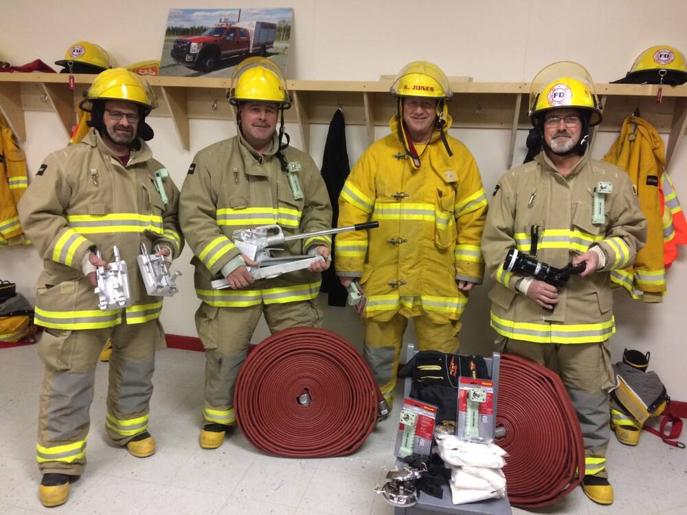 Fire Department with new hoses and accessories from IGA. Thank you!